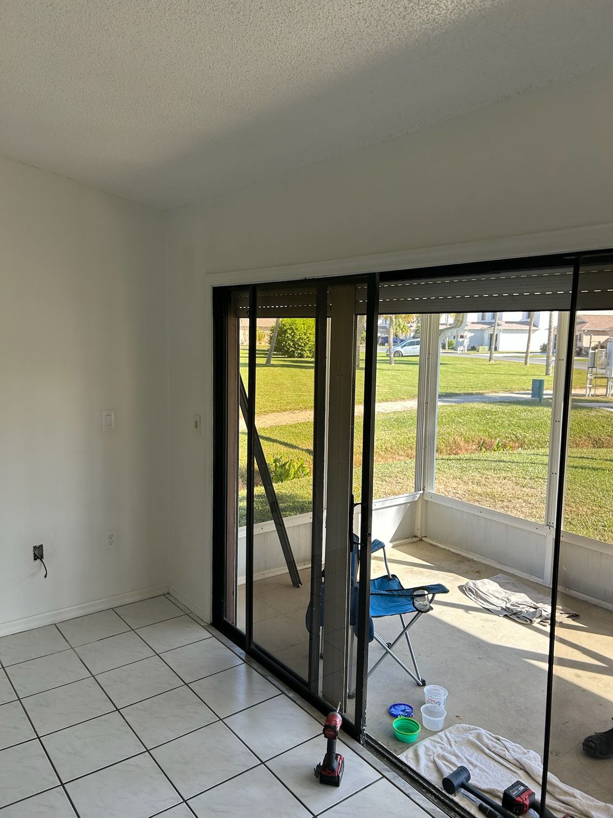 Newly serviced sliding glass doors in an empty living room — sliding glass door services in Winter Springs, Florida