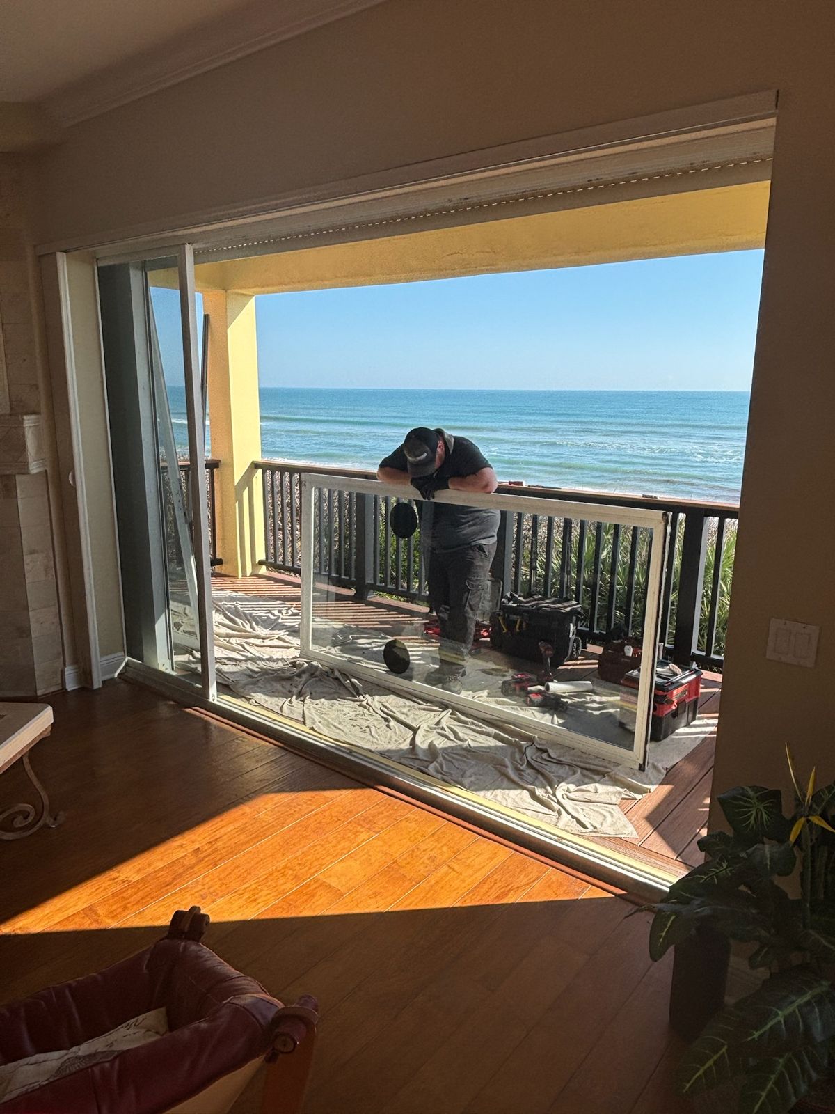 Sliding glass door replacement in an oceanfront living room — sliding glass door services in Viera, Florida