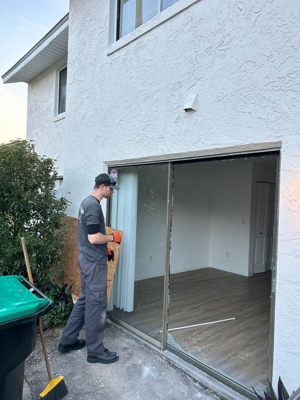 Technician preparing a new sliding glass door opening — sliding glass door services in Heathrow, Florida