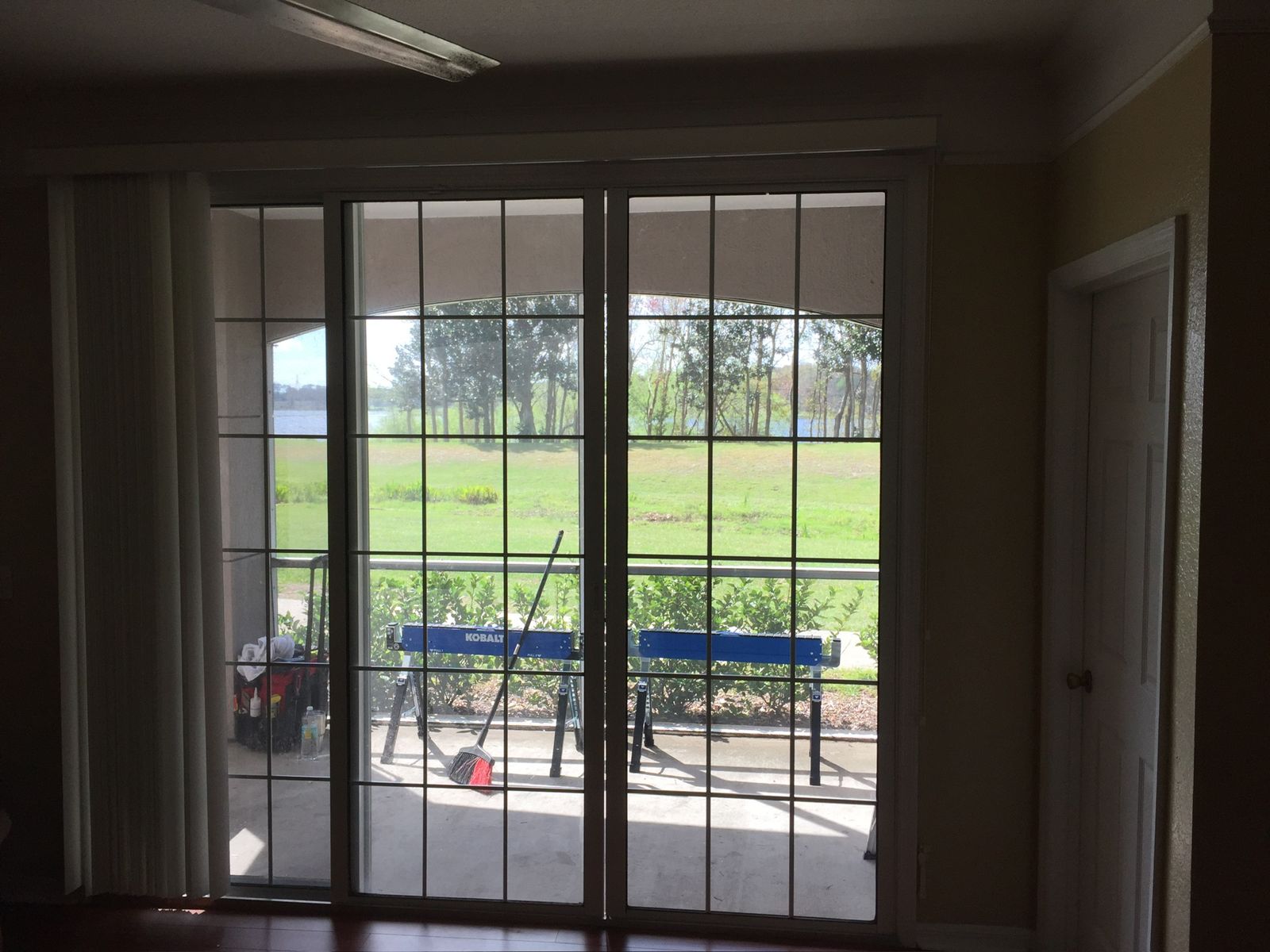 Sliding glass doors looking out over a golf course — sliding glass door services in DeLand, Florida