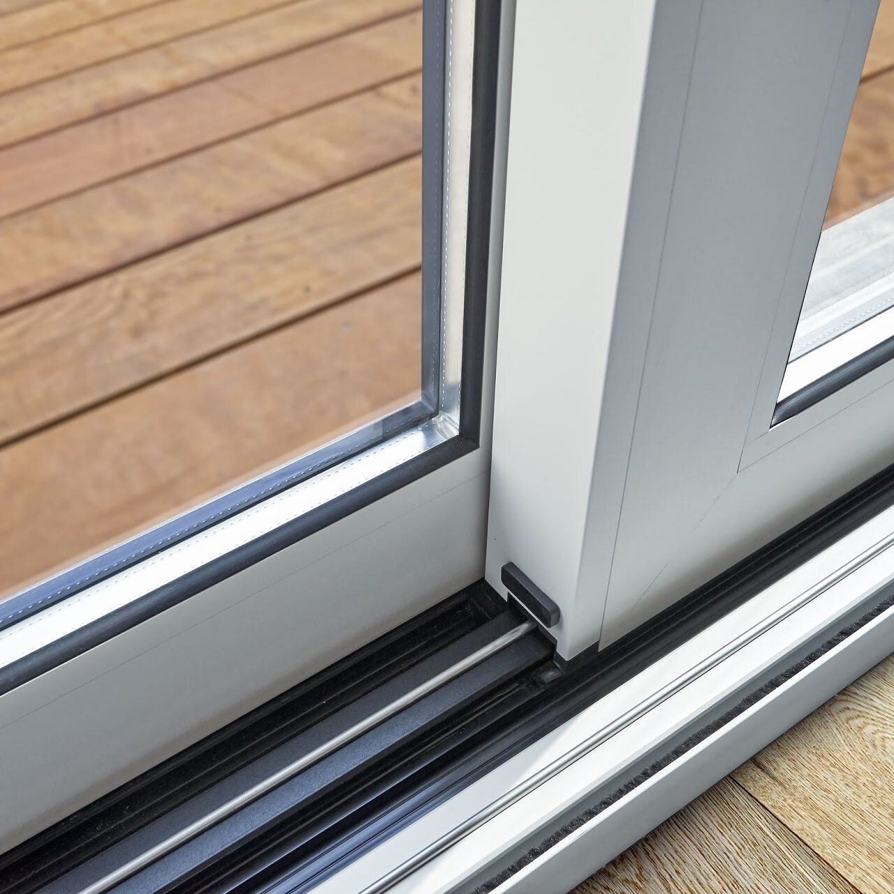 Repaired sliding glass door track and stainless steel cap